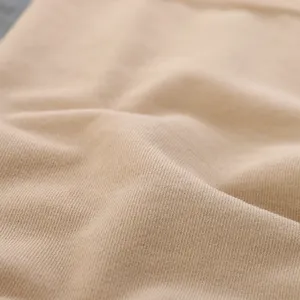 Close-up detail of soft knitted thermal fabric texture, elastic and cozy material for winter.