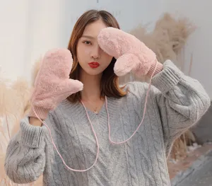 Winter warm fluffy mittens for women with hanging strap, thick plush windproof cold weather gloves.