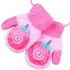 Cute pink winter plush kids mittens with lollipop design and hanging neck strap for baby warmth.