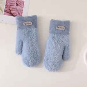 Detail view of women winter warm plush knit mittens, cute faux mink fleece soft outdoor gloves.