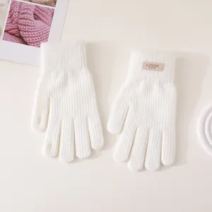 White knitted five-finger gloves for winter warmth, soft texture, cozy cold weather gear.