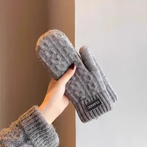 Thickened gray knitted mittens for winter outdoor warmth, comfortable woolen fleece lined gloves.