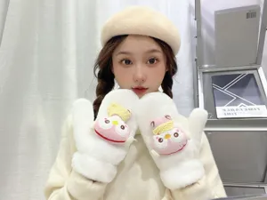 Detailed close-up of thick plush winter mittens with cute cartoon design, warm fleece lining.