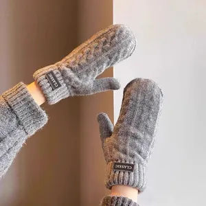 Grey thick knit mittens for winter warmth, soft wool hand gloves for cold weather outdoor.