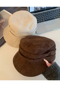 Detail view of faux suede retro flat top riding hat, elegant pleated design for women.