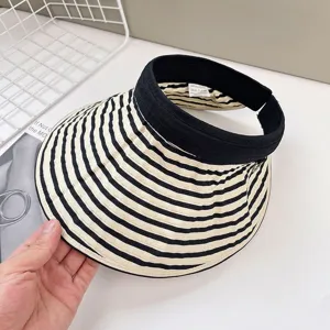 Black and white striped empty top sun visor hat, wide brim outdoor UV protection detail view.