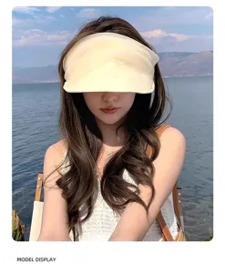 Close-up details of the lightweight beige organza sun visor hat, perfect for summer beach.