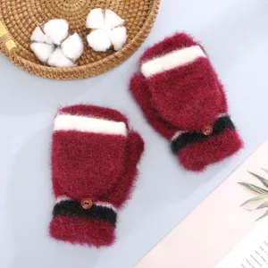 Cozy plush winter gloves detail shot showcasing soft red fabric, white trim, and cute button.