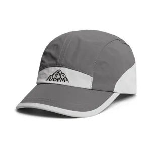 Close-up detail of the grey and white camping camp cap featuring mountain embroidery design.