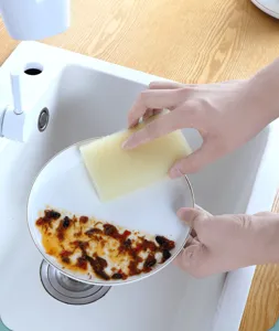 Kitchen cleaning sponge for washing dishes and pots, efficient scrubbing tool for daily use.
