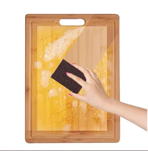 Kitchen cleaning sponge with carborundum abrasive surface for powerful pot and pan dirt removal.