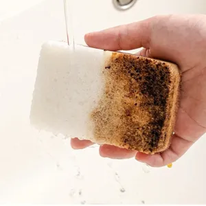 Thickened wood pulp dishwashing sponge, double-sided kitchen cleaning wipe in use.