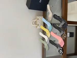 Detailed shot of trendy women clear strap stiletto high heels and bag in a stylish display scene.