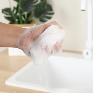 Compressed wood pulp sponge detail showing rich foam absorption and soft texture for kitchen and bath.
