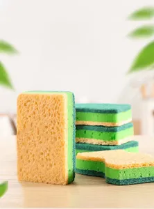 Detailed view of wood pulp sponge block, showing textured cleaning layers for kitchen use.
