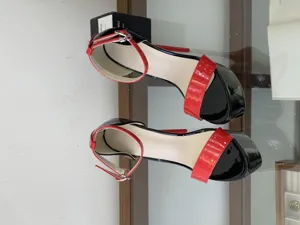 Black and red patent leather platform high heels, ankle strap stiletto pole dancing shoes.