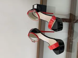 Black and red patent leather platform high heels, extreme high heels for pole dancing.