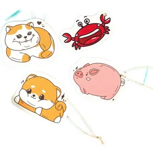 Detailed close-up of cute cartoon animal wood pulp sponges, featuring flexible texture and hanging rope.