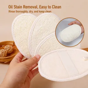 Natural loofah sponge kitchen dish washing scrub pad with elastic hand strap for pot cleaning.