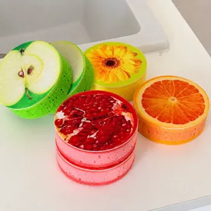 Round wood pulp sponge dishwashing kitchen cleaning tool with cute fruit print designs.