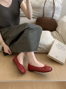 Chic red split toe flat ballet shoes with lovely bow knot design for daily commute comfort.