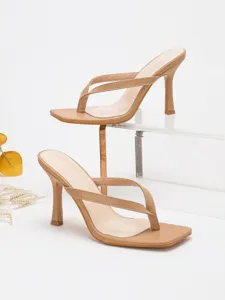 Detailed view of beige square toe high heel thong sandals, elegant strappy mule design.