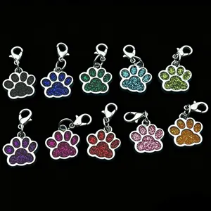 Set of 10 colorful metal paw print keychains with lobster clasps, glitter epoxy charms.