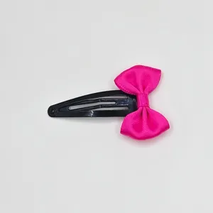 Cute hot pink ribbon bow black snap hair clip for sweet girls and kids hair styling.