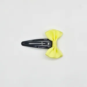 Black BB hair clip with a bright yellow satin bow, sweet and simple hair accessory for girls.