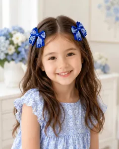 Detail view of the blue plaid grosgrain bow hair clip with pearl flower accents for girls.