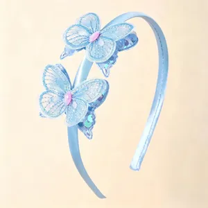 Blue satin butterfly headband with shiny sequins and cute lace details for girls.
