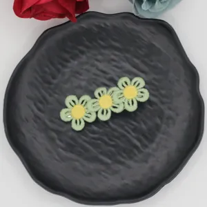 Charming children's embroidered flower hairpin with sweet triple design for cute daily girls hair styling.
