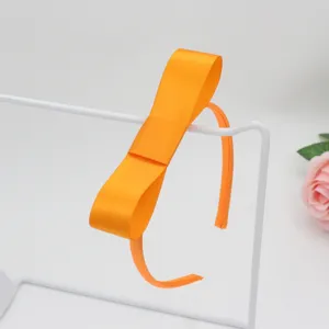 Orange satin ribbon bow headband for girls, stylish solid hair accessories for daily wear.