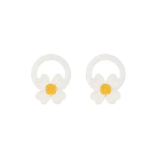 Close-up of cute white daisy flower hair ties with yellow center and elastic band detail.