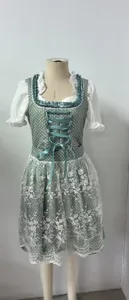 Traditional German Dirndl dress with floral print, white blouse, and lace apron details.