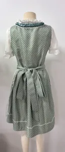 Detailed back view of the green dirndl dress featuring a cute bow tie and delicate print.