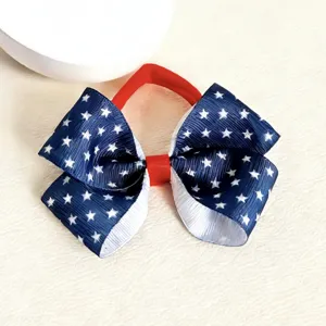 Independence Day kids hair bow detail, red white blue star print patriotic hair band accessory.