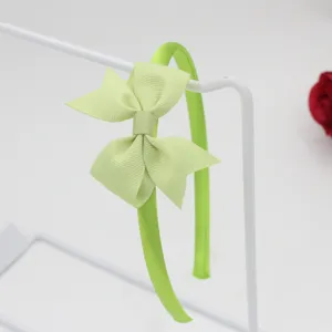 Serre-tête nœud ruban gros-grain vert clair, accessorio de coiffure simple et polyvalent.
