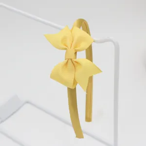 Serre-tête nœud ruban jaune, accessoire de cheveux uni et simple pour un style quotidien.