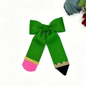 Pencil design bow hair clip detail, green grosgrain ribbon back to school hair accessory.