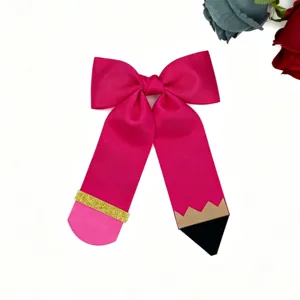 Large pencil hair bow detail showing grosgrain ribbon back to school cute student hair clip.