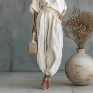 Stylish solid color off-shoulder top and loose casual harem pants two-piece set for women.