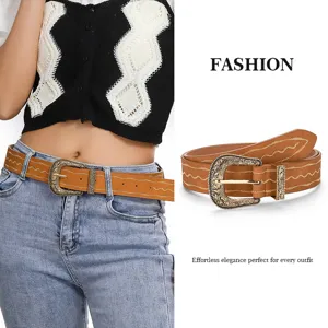 Detailed view of women vintage brown PU leather belt with ornate metal buckle and embroidery.