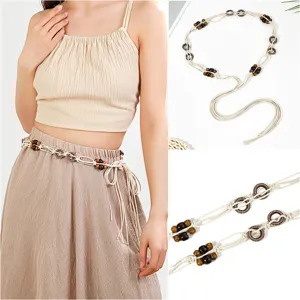 Boho woven waist chain with wooden beads and metal rings, detailed close-up shot of fashion belt.
