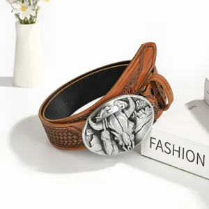 Vintage western cow skull leather belt with alloy buckle, detailed embossed pattern design.