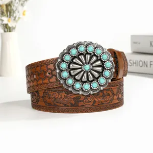 Vintage bohemian leather belt with large turquoise silver buckle and floral embossed details.