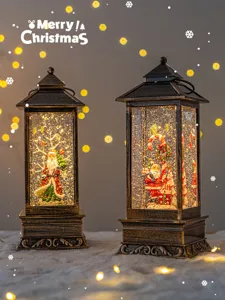 Christmas snow globe lantern with Santa Claus figurine and warm lights for holiday decor