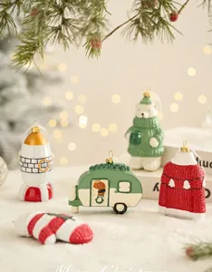 Cute ceramic Christmas tree hanging ornaments set for holiday home decoration and festive party.