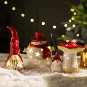 Weihnachten keramik wichtel schneemann pilz tischdekoration beleuchtet festliche szene