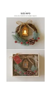 Festive Christmas wreath with wooden LED house, pinecones and red berries for decor.